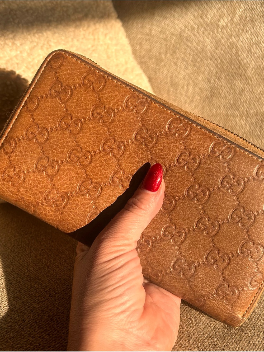 Gucci “Guccissma” embossed leather zip around wallet with bamboo detail